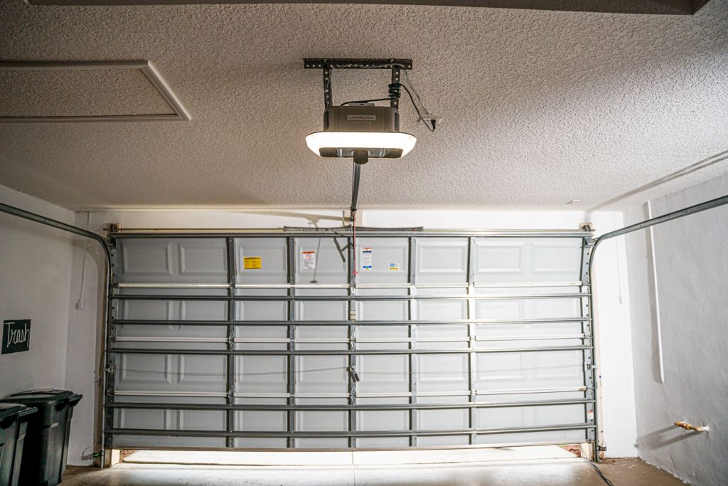 Slightly open garage door and garage door opener