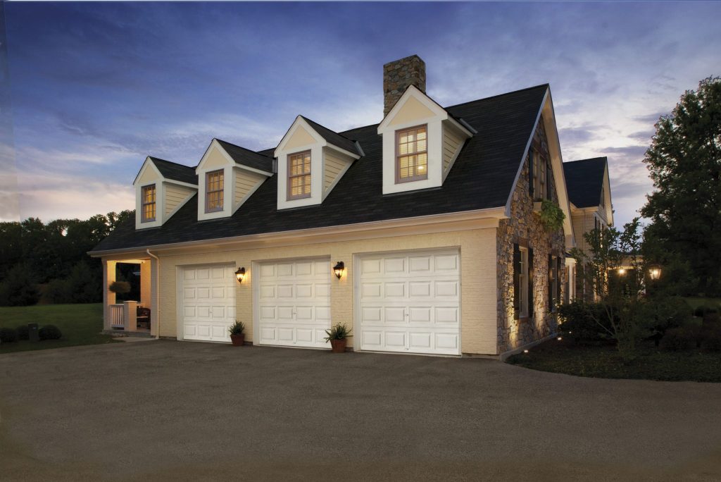 Home with 3 White Garage Doors
