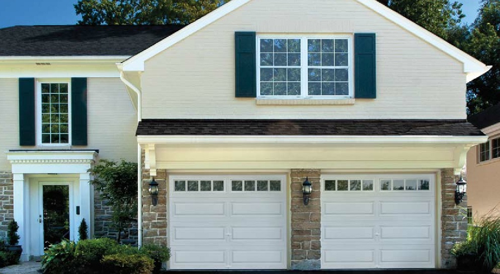 White House with two white garage doors