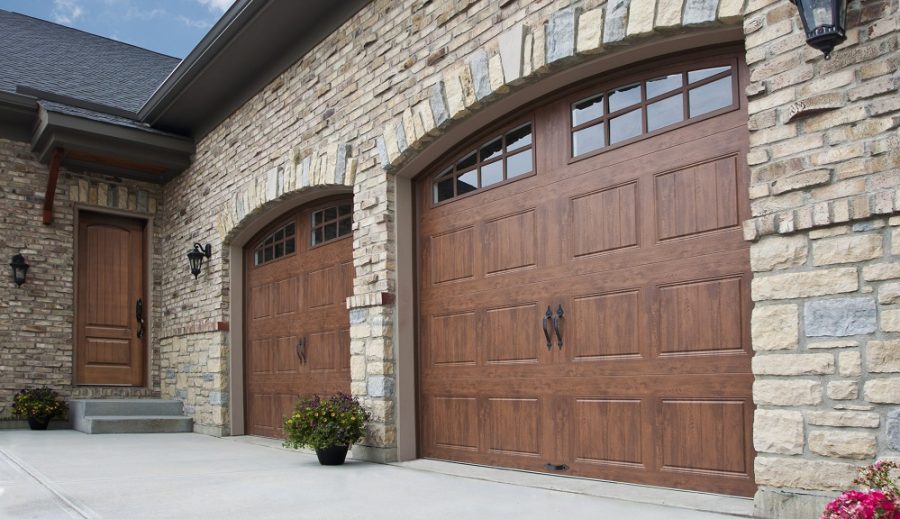 Arched Wood Carriage House Garage Door with Complement Front Door