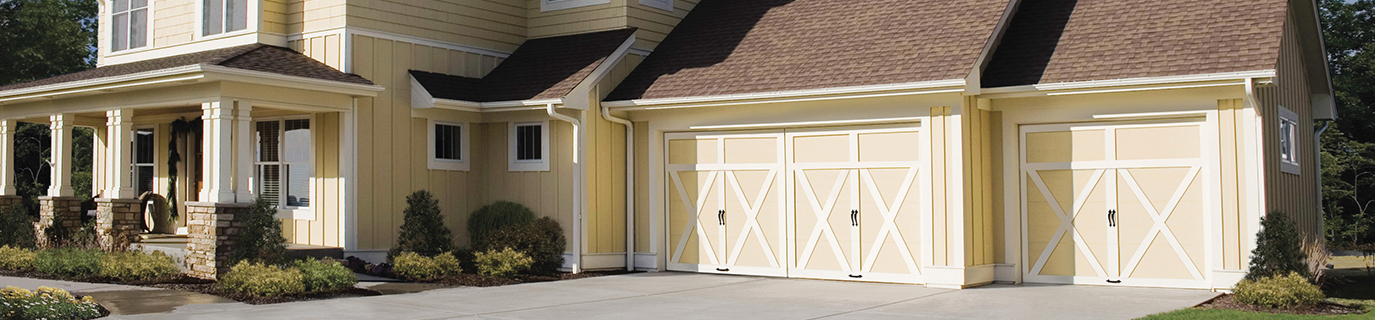 White and Yellow House with Grand Harbor Collection Garage Door