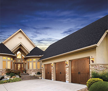 Residential home with 3 car Clopay Carriage House garage doors