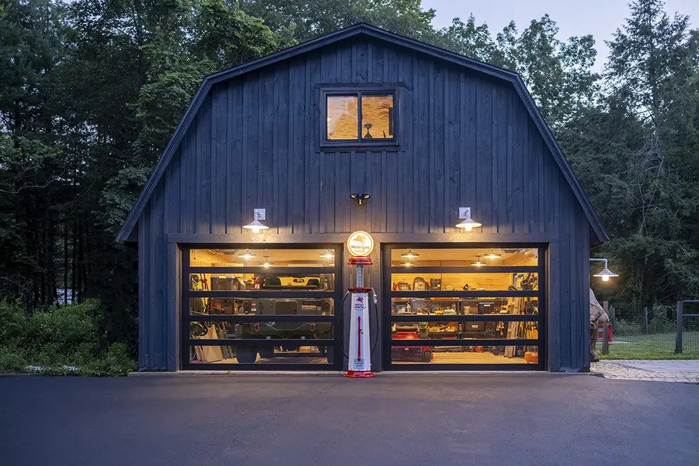 Exterior garage with car inside and air pump